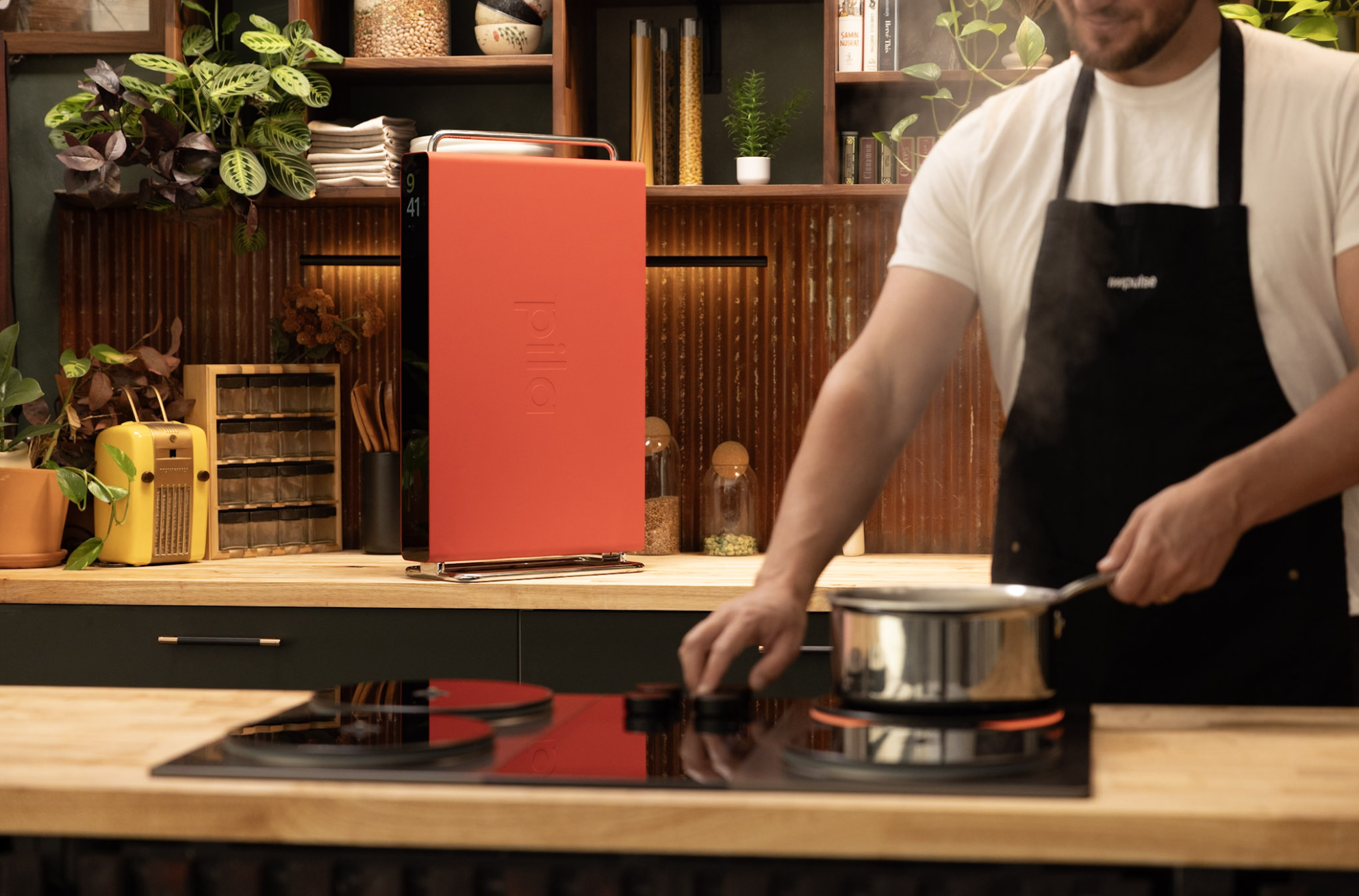 Chef using Impulse cooktop with Pila battery